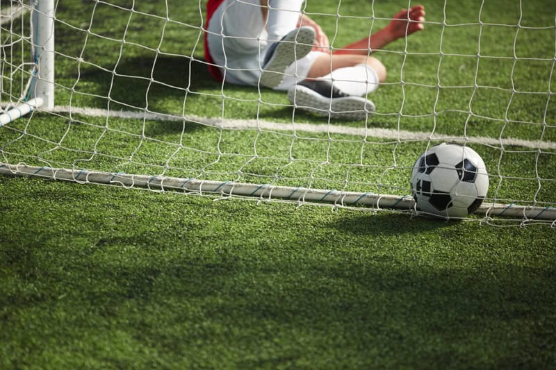 Football in goal, goalie defeated